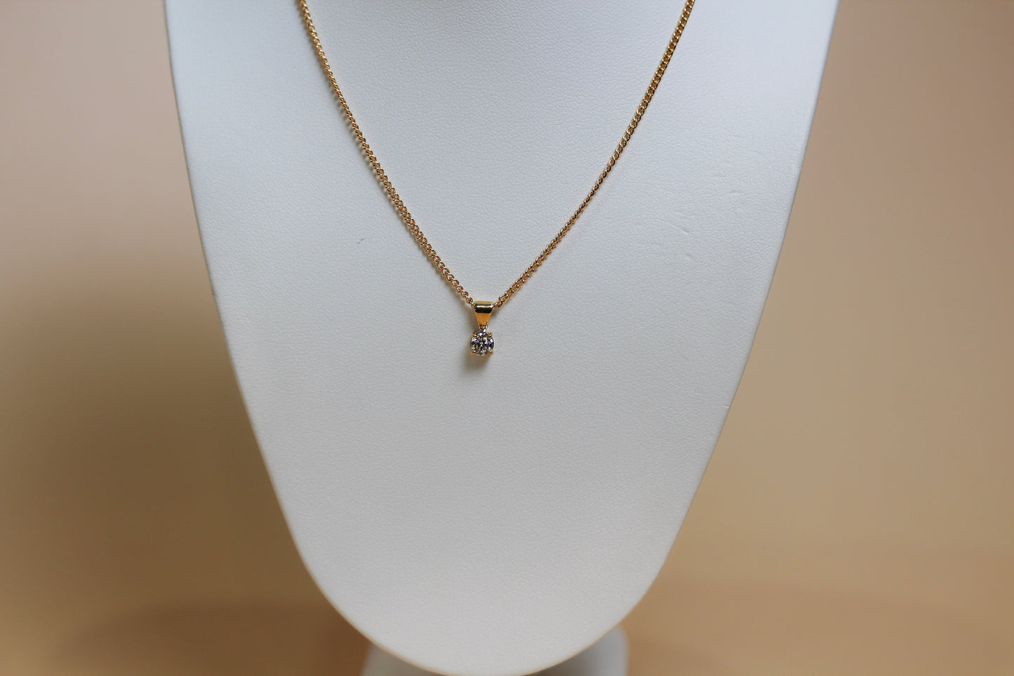0.26ct lab diamond round brilliant solitaire pendant in 9ct yellow gold, four-claw setting on fine cable chain