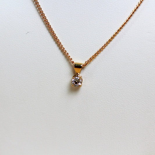 Close-up of 0.26ct lab diamond in four-claw 9ct yellow gold solitaire setting — Jon Crosbie Jeweller