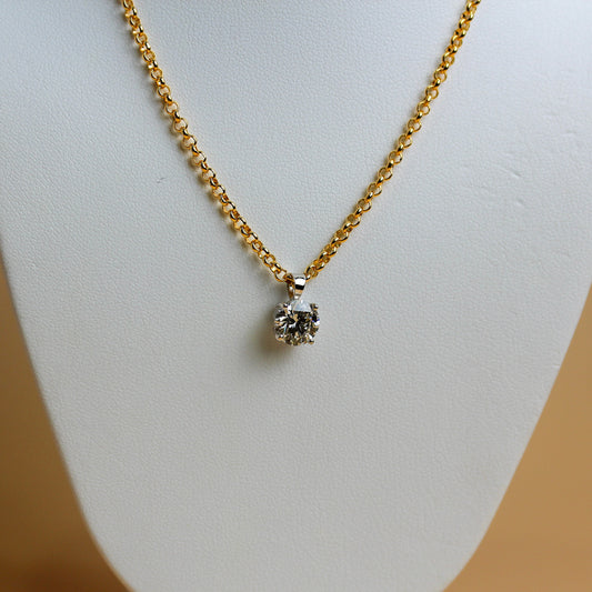 Close-up of 1.54ct lab diamond in white gold four-claw solitaire setting on yellow gold belcher chain — Jon Crosbie Jeweller